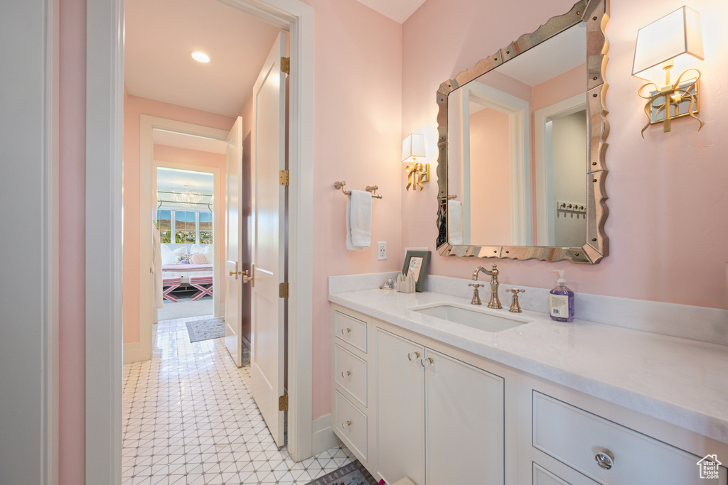 Bathroom featuring vanity and recessed lighting