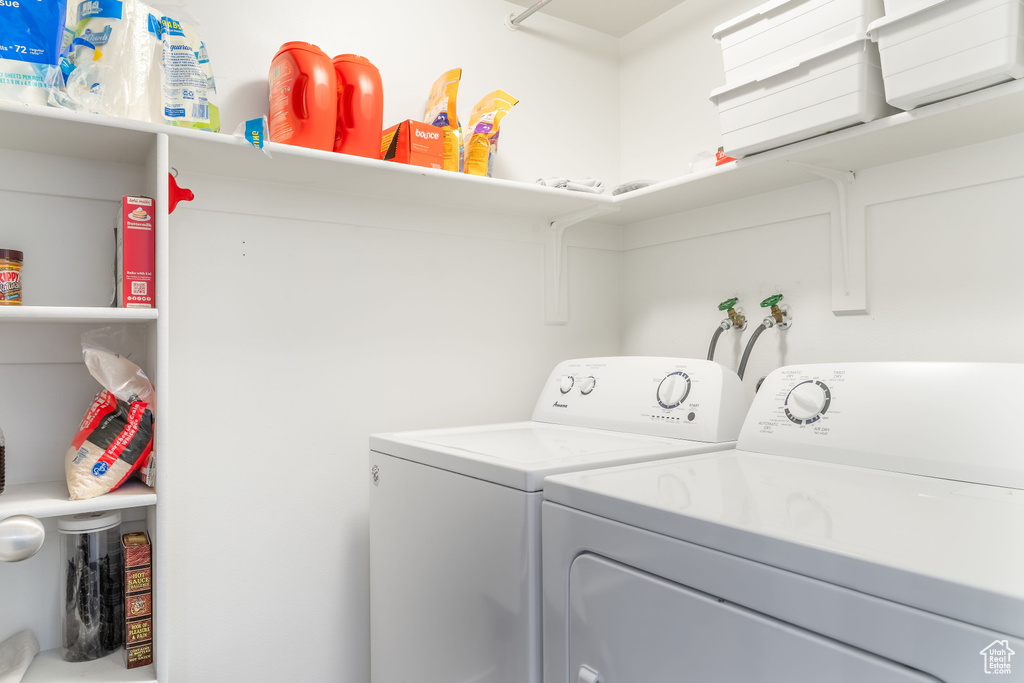 Laundry room with washer and clothes dryer