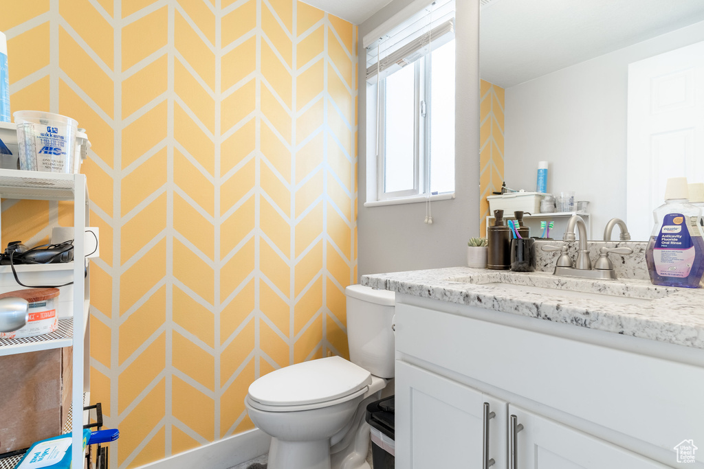 Bathroom featuring vanity and toilet