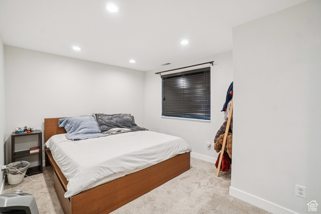 Bedroom featuring recessed lighting and light colored carpet