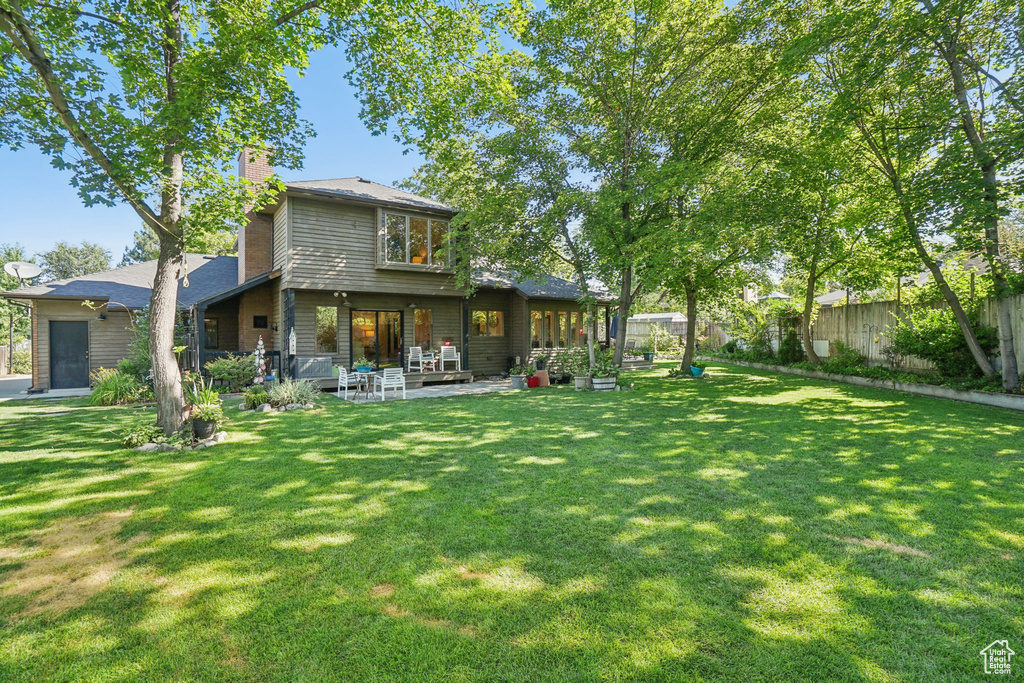Rear view of house with a chimney
