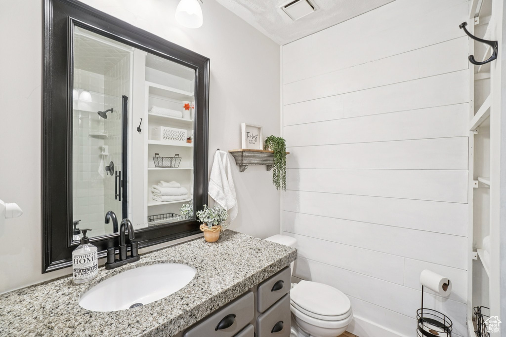 Bathroom with vanity and an enclosed shower