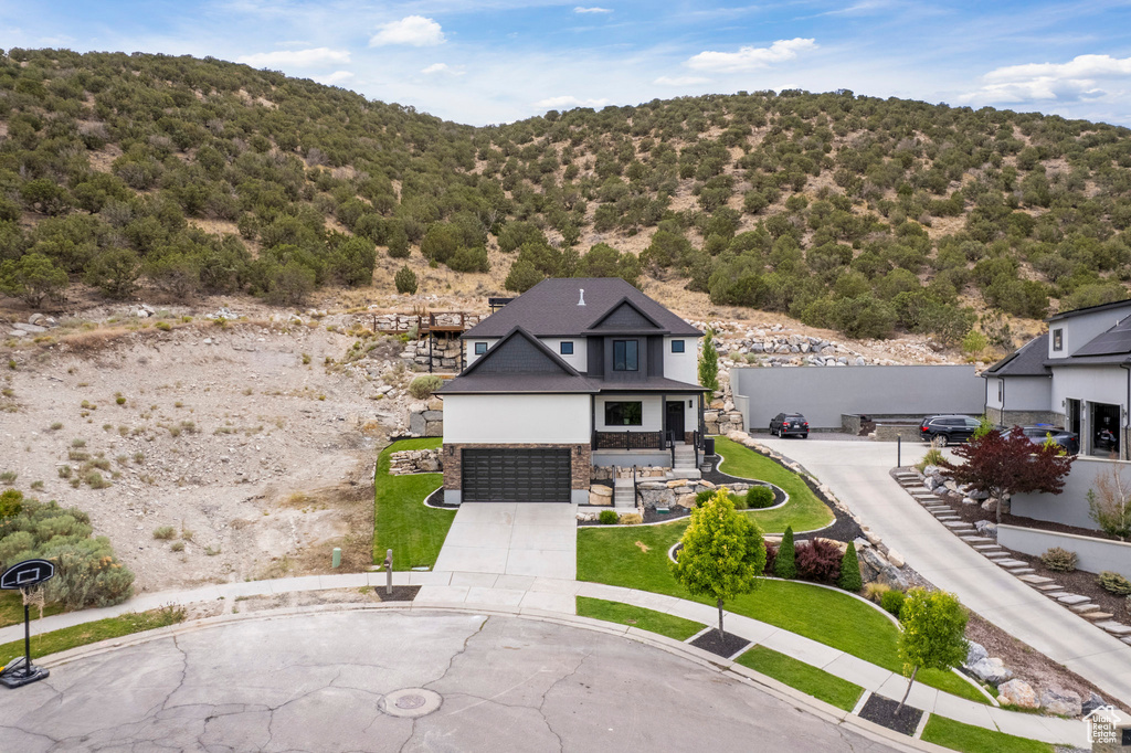 View from above of property featuring a heavily wooded area