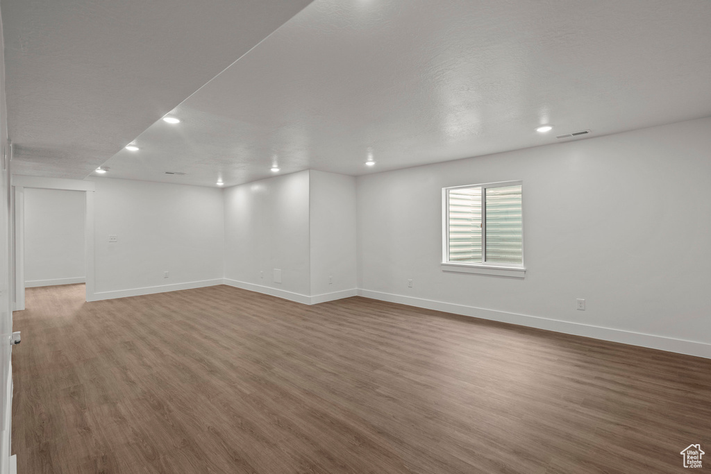 Unfurnished room with recessed lighting and wood finished floors