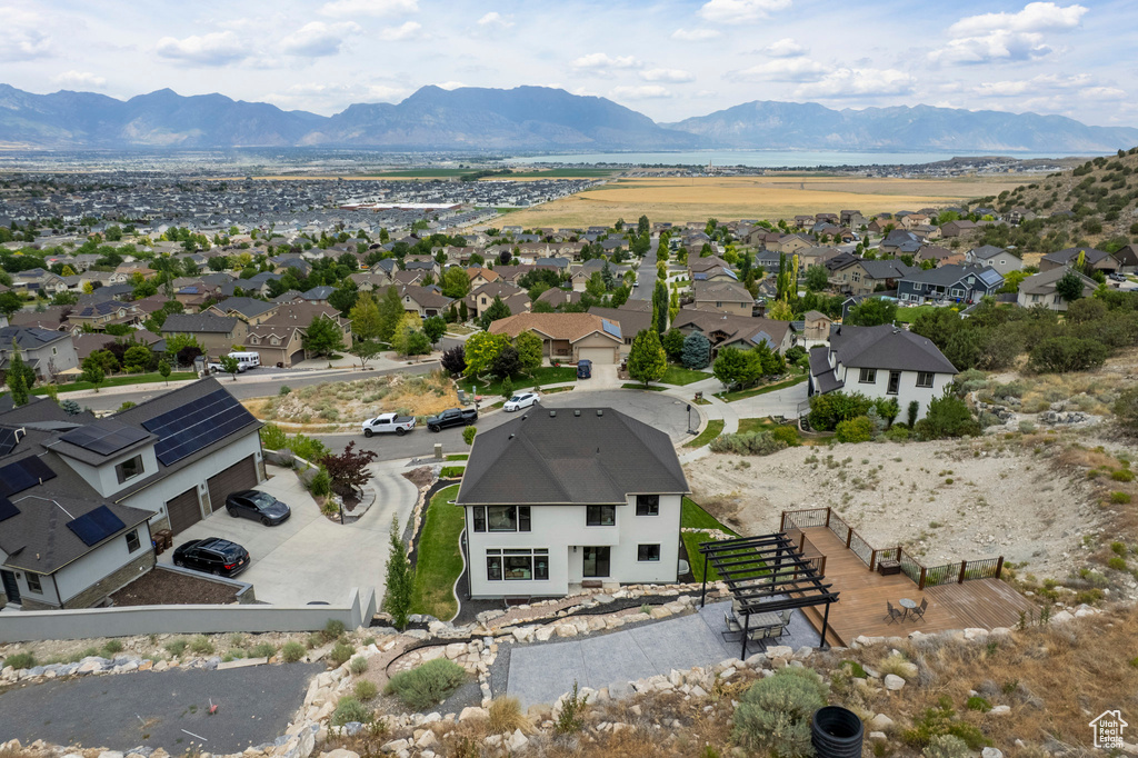 Aerial perspective of suburban area with a mountain backdrop