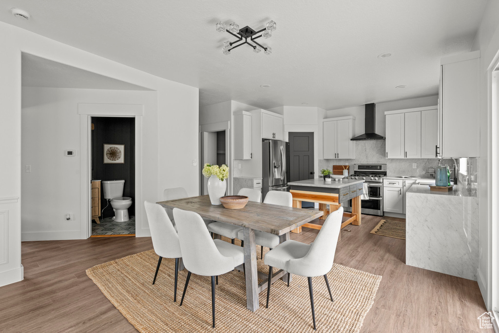 Dining space featuring light wood-type flooring