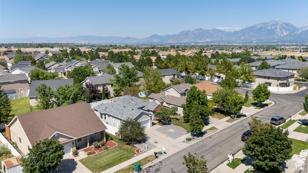 Aerial view of residential area with a mountainous background