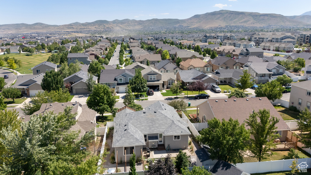Aerial view of residential area featuring a mountain backdrop