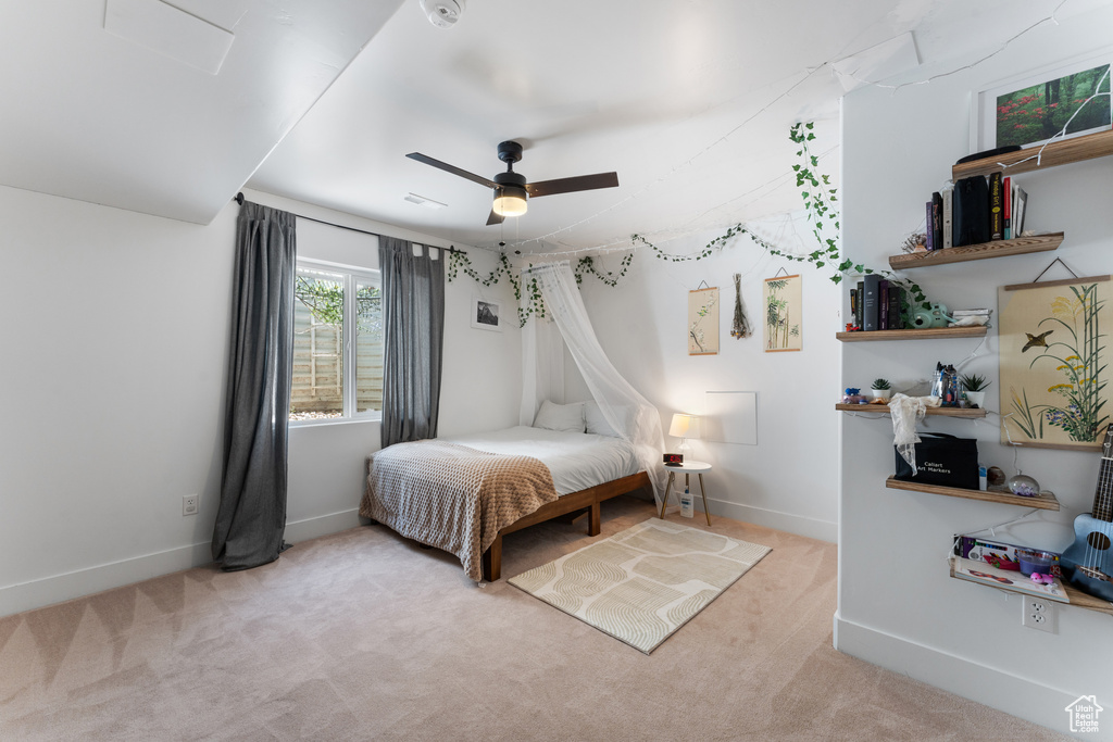 Bedroom with carpet floors and a ceiling fan