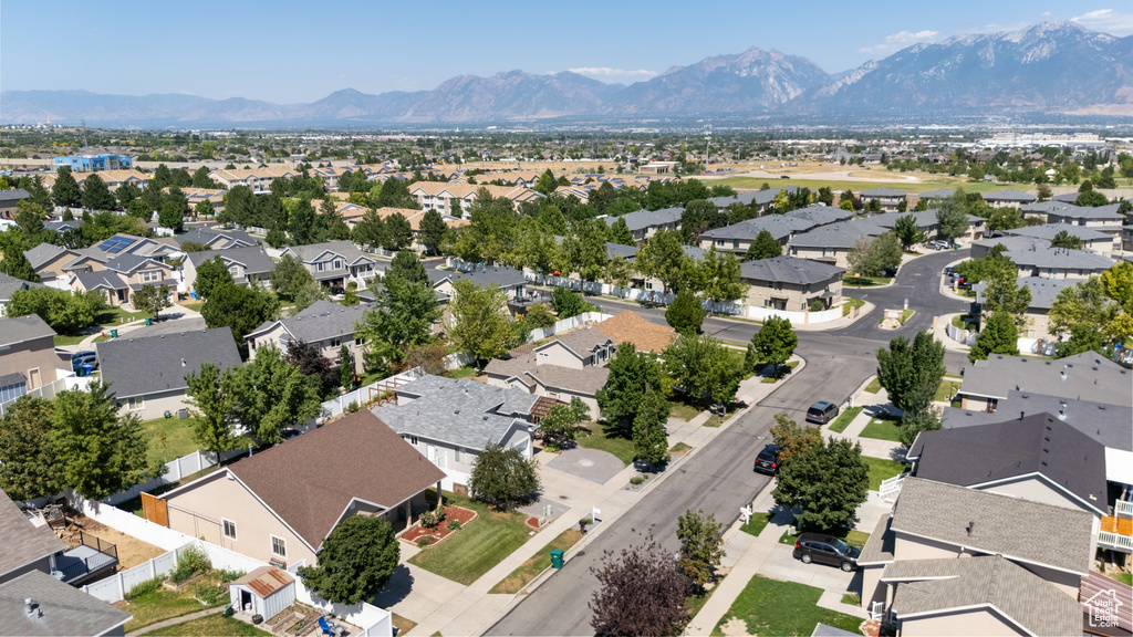 Aerial perspective of suburban area featuring a mountainous background