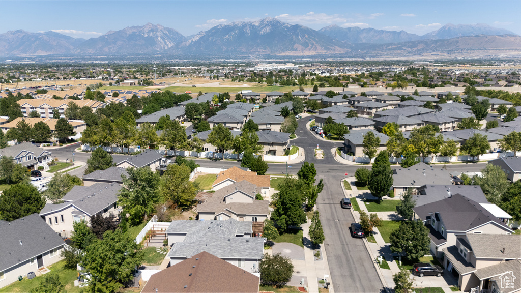 Aerial view of residential area featuring a mountain backdrop