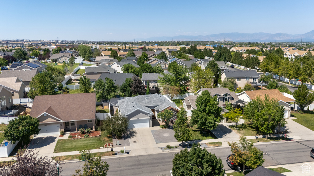 Aerial view of residential area featuring a mountainous background