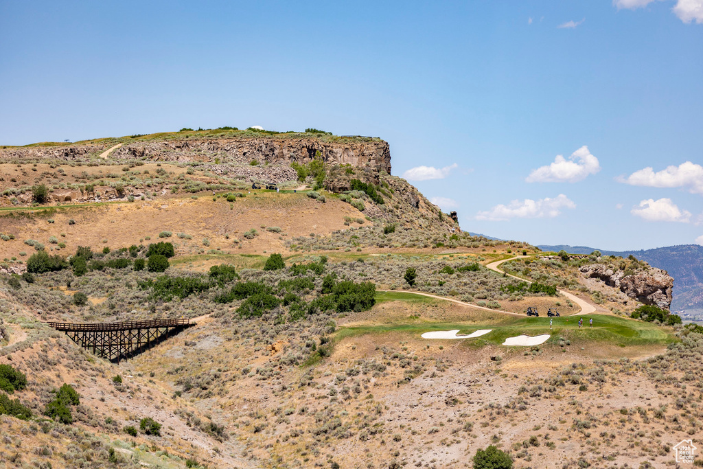 View of mountain background featuring a golf course