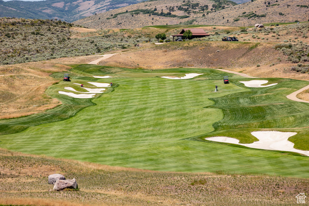 Surrounding community with a mountain view and view of golf course