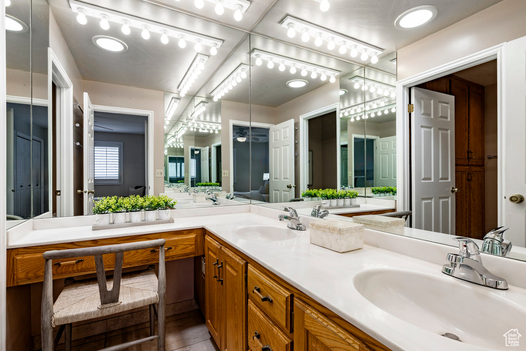 Bathroom featuring double vanity and tile patterned flooring