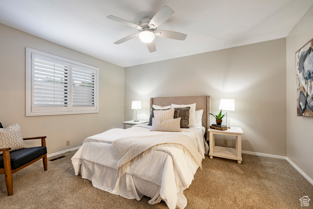 Bedroom featuring carpet and a ceiling fan
