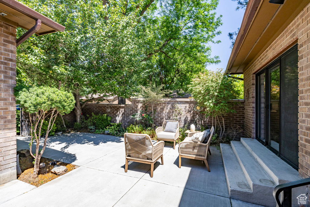 Fenced backyard featuring a patio and an outdoor living space