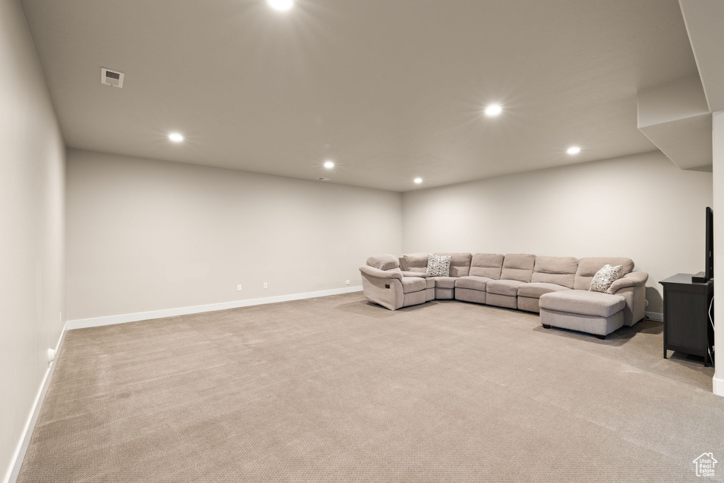 Living room with carpet floors and recessed lighting