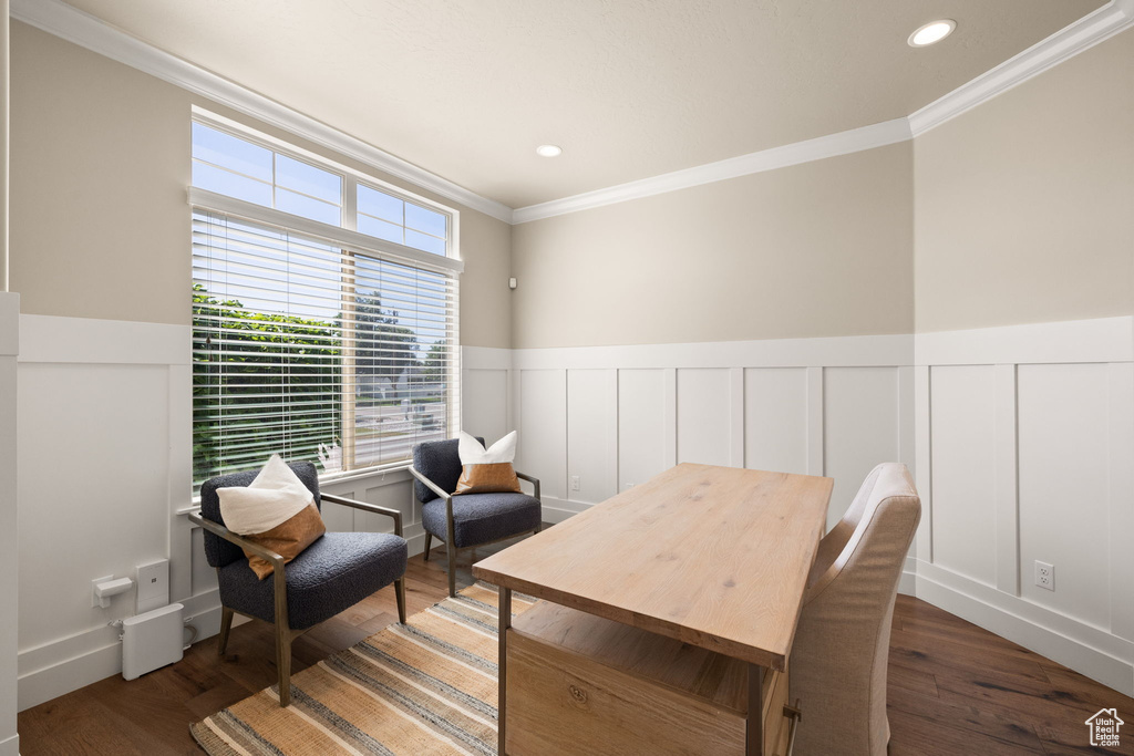 Sitting room featuring crown molding, a wainscoted wall, a decorative wall, wood finished floors, and recessed lighting