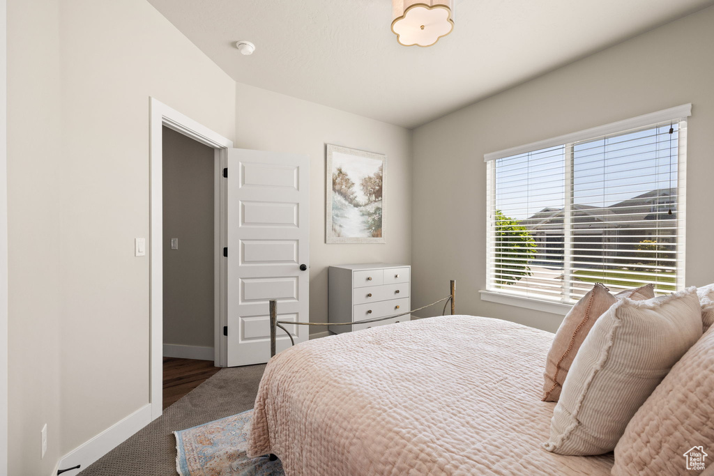 Bedroom with carpet and baseboards