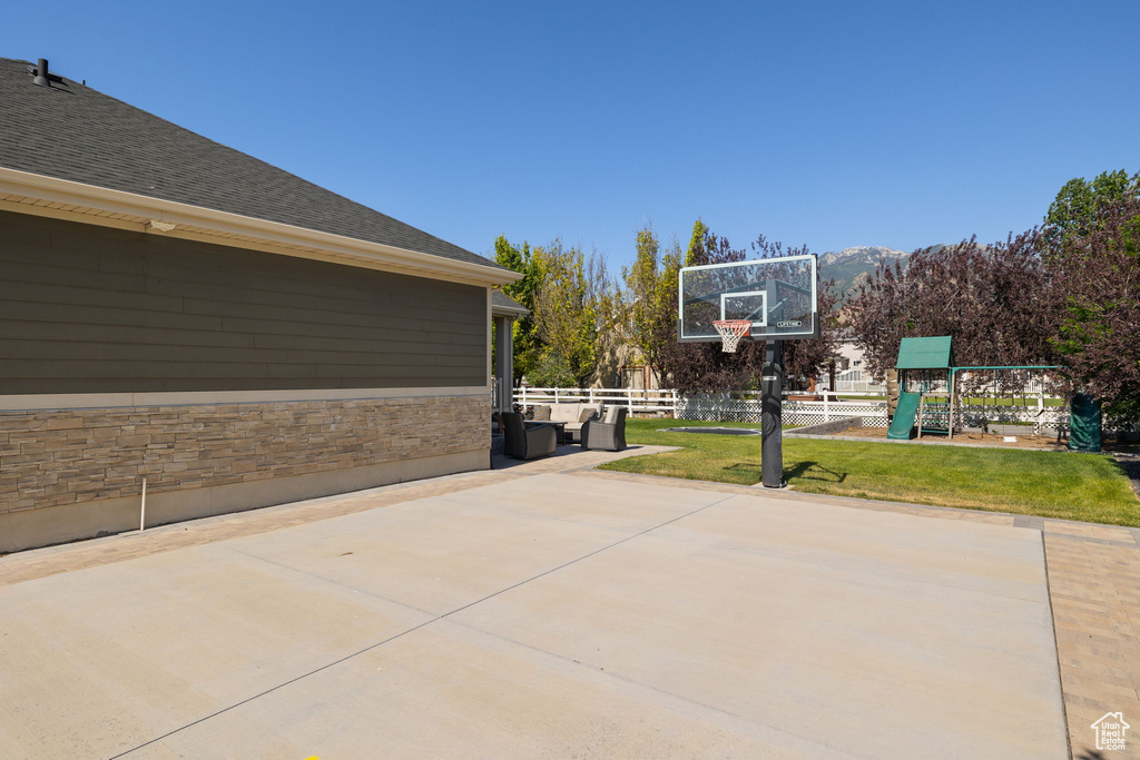 View of sport court with a playground