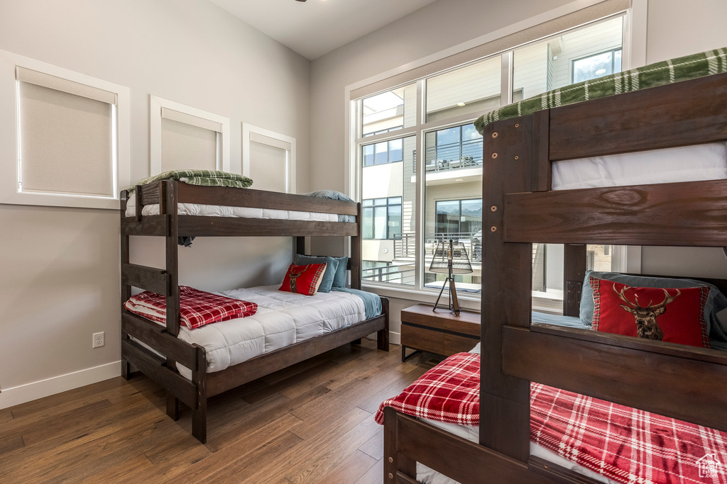 Bedroom featuring wood finished floors and access to outside