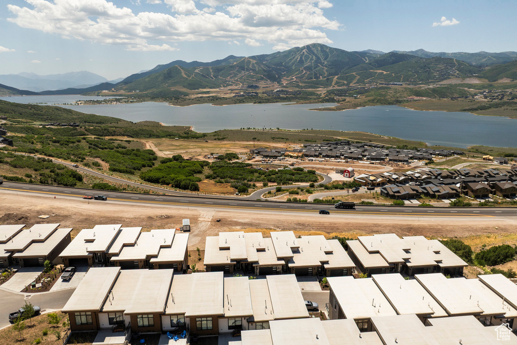 Aerial perspective of suburban area featuring a water and mountain view