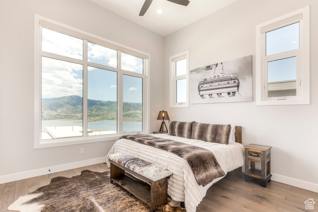 Bedroom featuring wood finished floors, recessed lighting, and ceiling fan