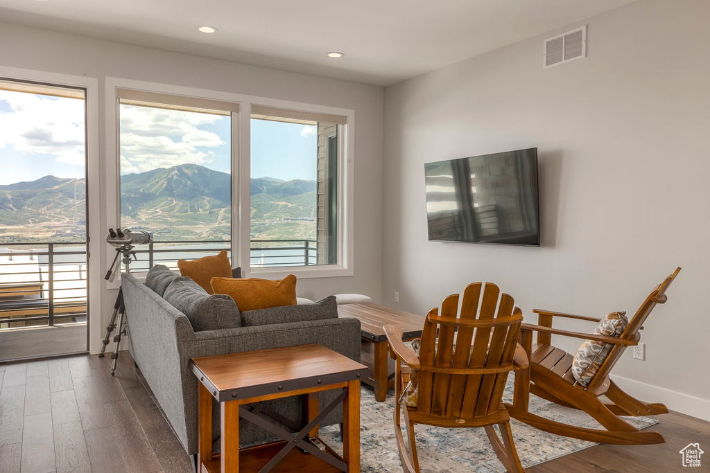Living area featuring a mountain view, wood finished floors, and recessed lighting