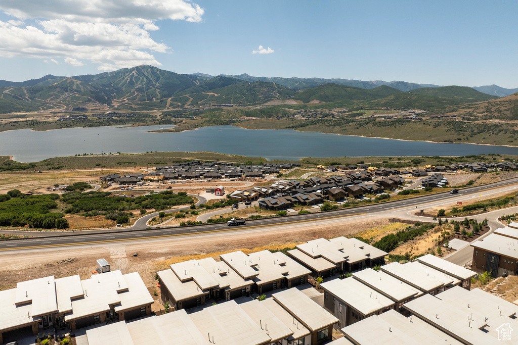 Aerial perspective of suburban area featuring a water and mountain view