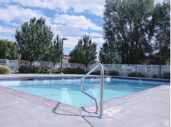 Community pool with a patio area