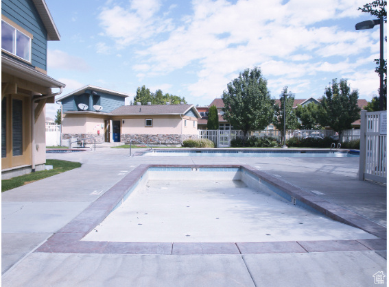 Community pool featuring a patio
