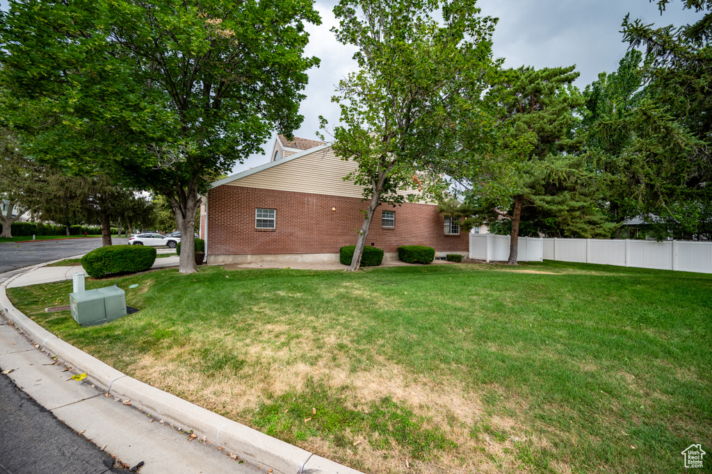 View of property exterior with brick siding