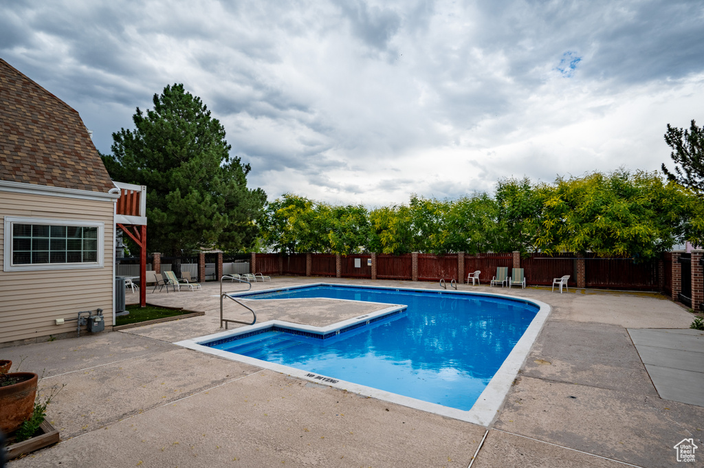 Community pool with a patio area