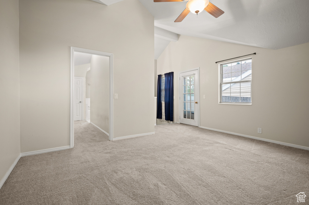 Unfurnished room with a ceiling fan and carpet flooring