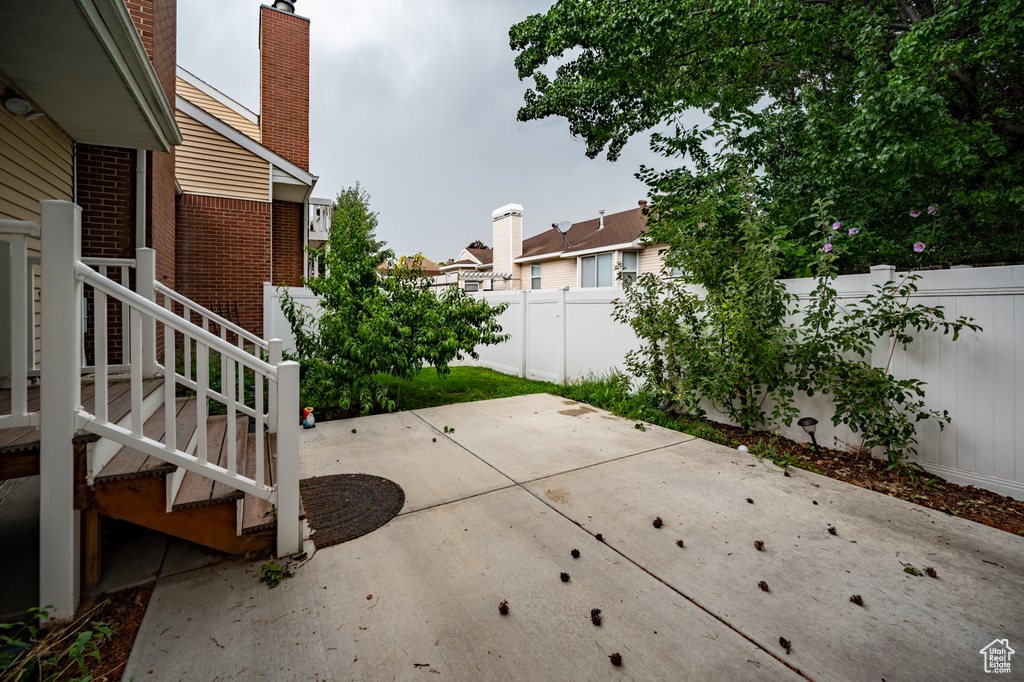 Fenced backyard featuring a patio