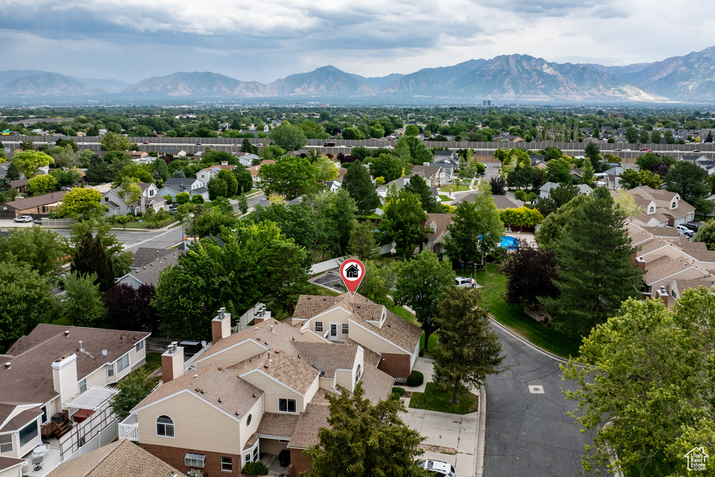 Aerial perspective of suburban area featuring a mountain backdrop