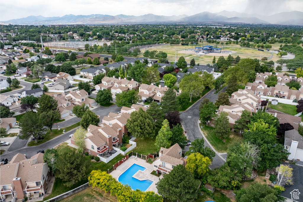 Aerial view of residential area featuring a mountainous background