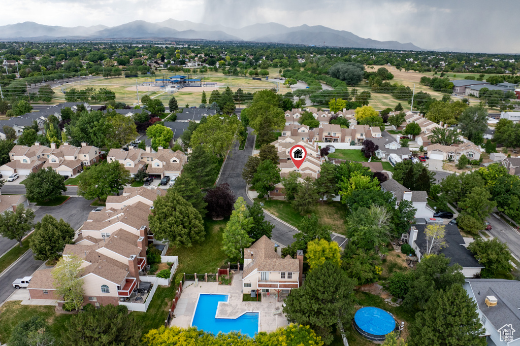 Aerial perspective of suburban area with a mountainous background