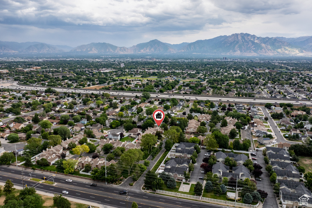 Aerial view of property\'s location with a mountainous background and nearby suburban area