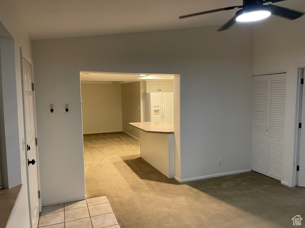 Corridor with light colored carpet