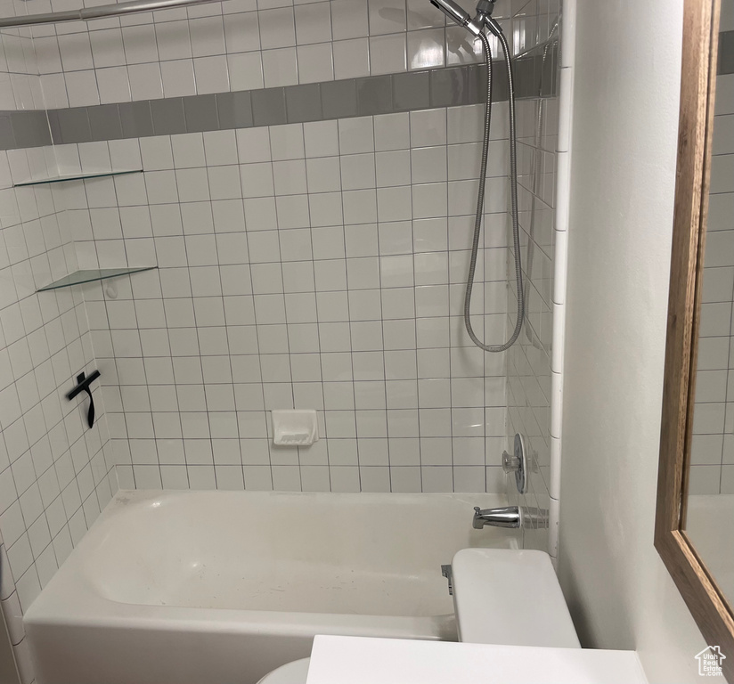 Full bath with toilet and shower / washtub combination