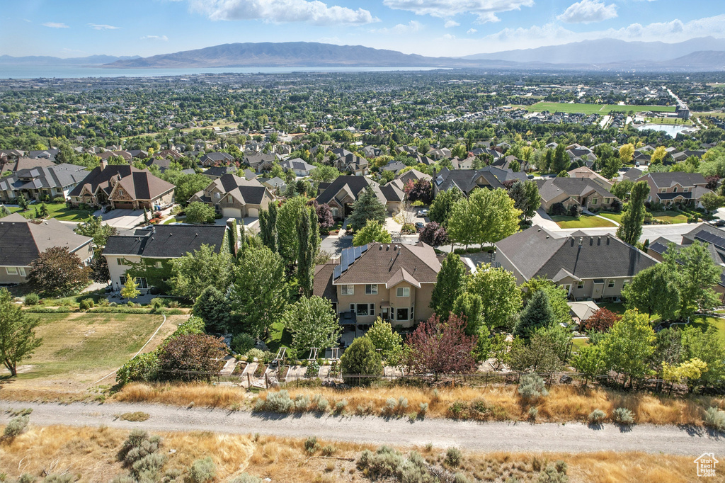 Aerial perspective of suburban area with a mountainous background