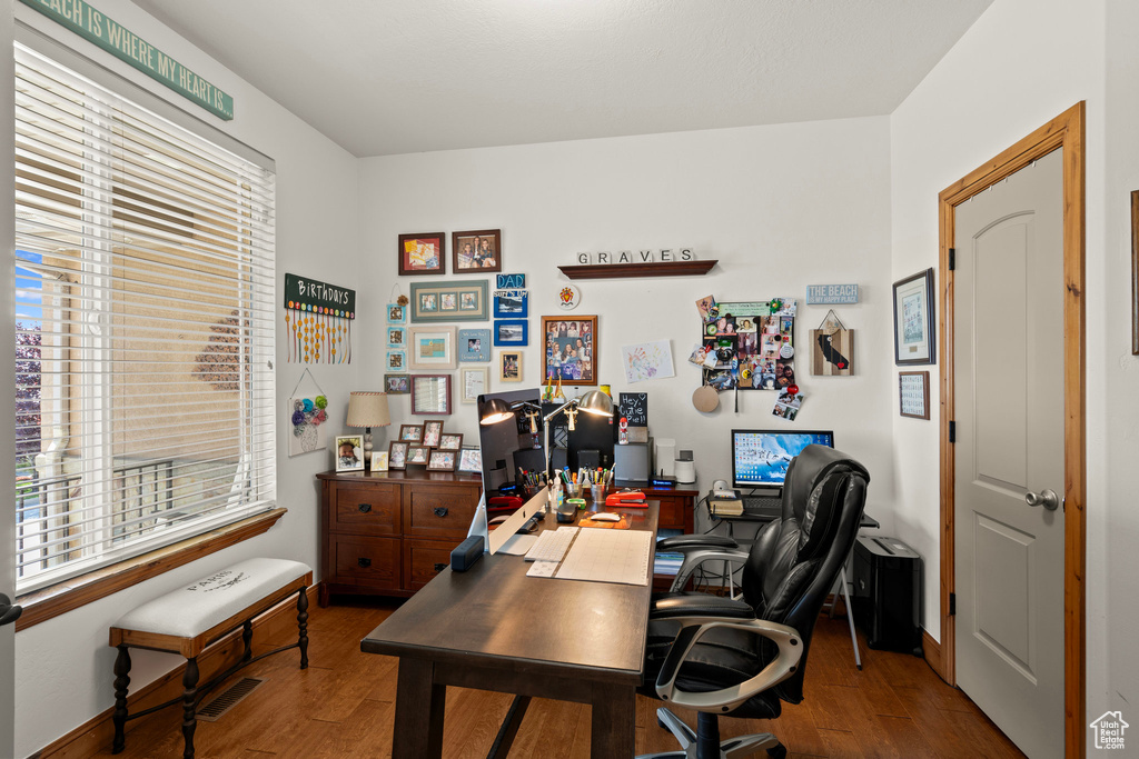 Office area featuring wood finished floors and baseboards