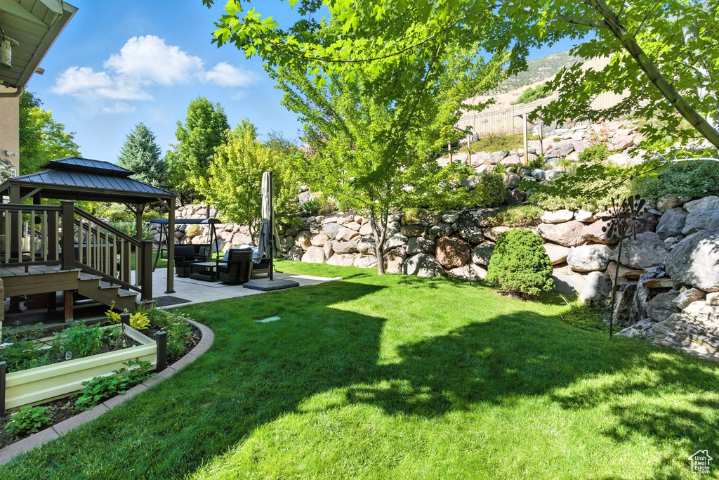 View of grassy yard with a gazebo