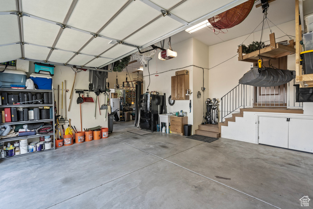 Garage featuring a garage door opener