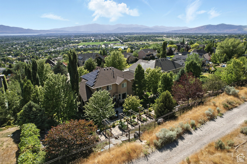 Aerial perspective of suburban area featuring a mountain backdrop
