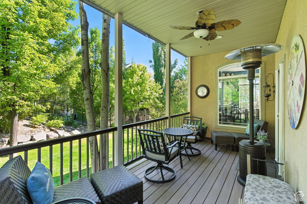 Sunroom with a ceiling fan