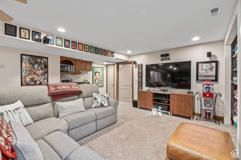Living area featuring carpet and recessed lighting