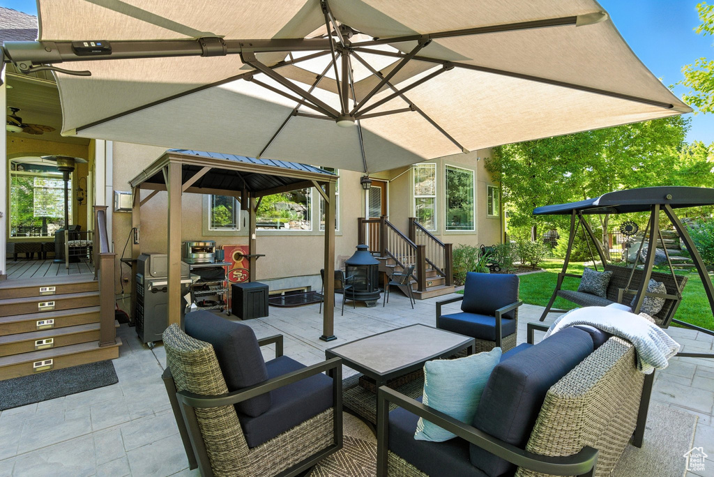 View of patio featuring outdoor lounge area, a gazebo, and a grill
